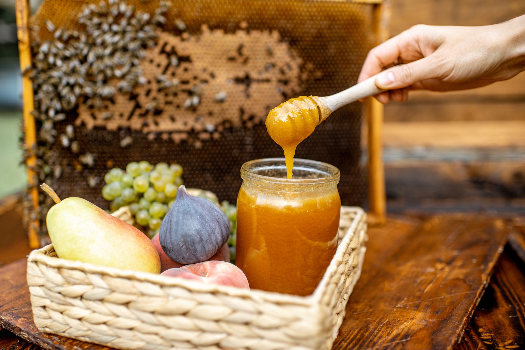 Sweet fruits and honey on the beehive